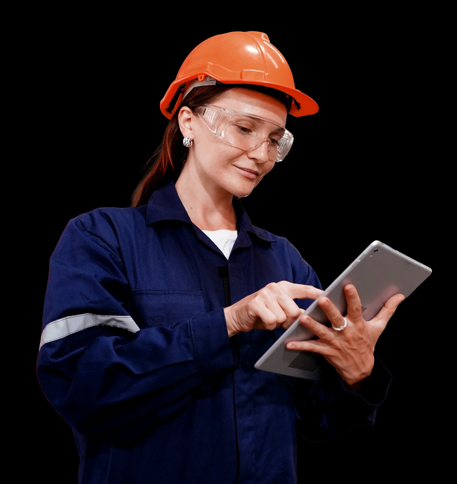 Worker in a hard hat checking a tablet